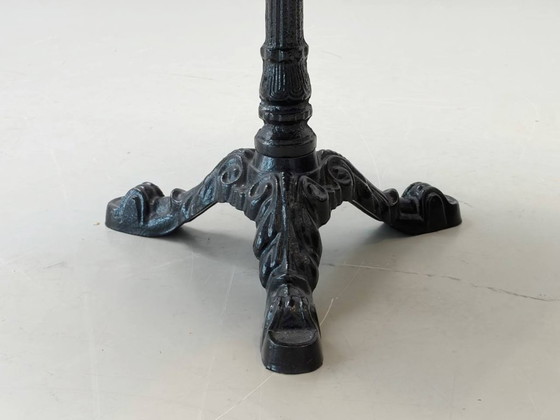 Image 1 of Bistro table made of acacia wood with a cast iron base in country style