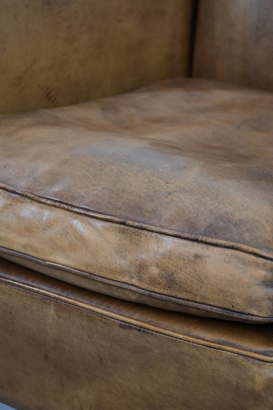 Image 1 of Subtiele vintage schapenleren fauteuil/ armchair met een mooie lichte kleur en sierlijke pootjes