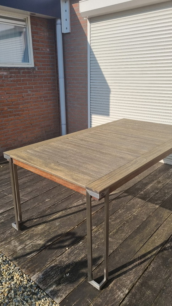 Image 1 of Set da giardino con tavolo in teak e 4 sedie in acciaio inox, realizzato in teak e textilene.