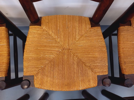 Image 1 of Set van 6 vintage brutalistische stoelen van Georges Robert, gemaakt van hout en stro, uit de jaren 50 en 60.