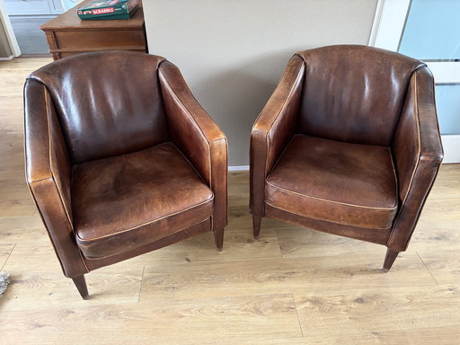 2 vintage schapenleren clubfauteuils 