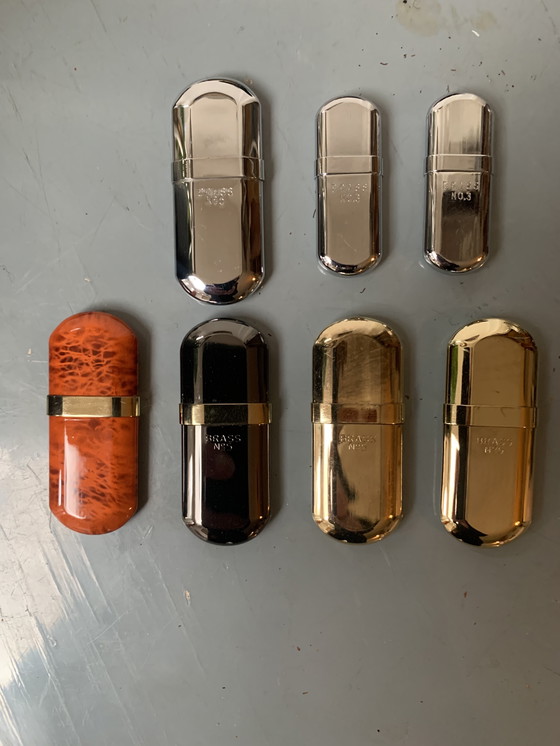 Image 1 of Verzameling Brass benzine aanstekers no 3 en no 5 in prima staat incl. leren hoesjes
