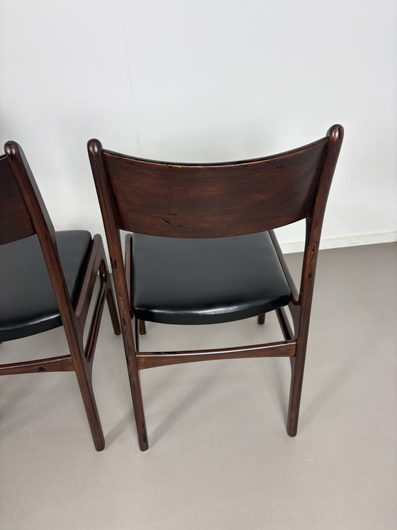 Image 1 of Set off 4 Vintage Palissander Wood With Black skai Leather dining chairs