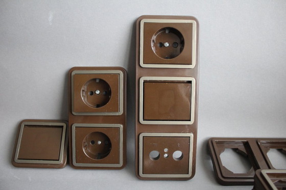 Image 1 of Large collection of vintage brown light and socket switches from the 1970s, brand BLASS.