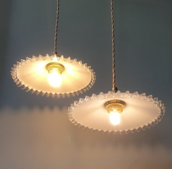 Image 1 of 2 vintage hanglampen van wit opaline glas met een transparante sierrand.