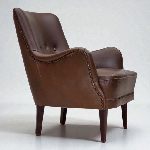 Dänischer Sessel aus den 1960er Jahren, Möbelleder, Beine aus Eschenholz.