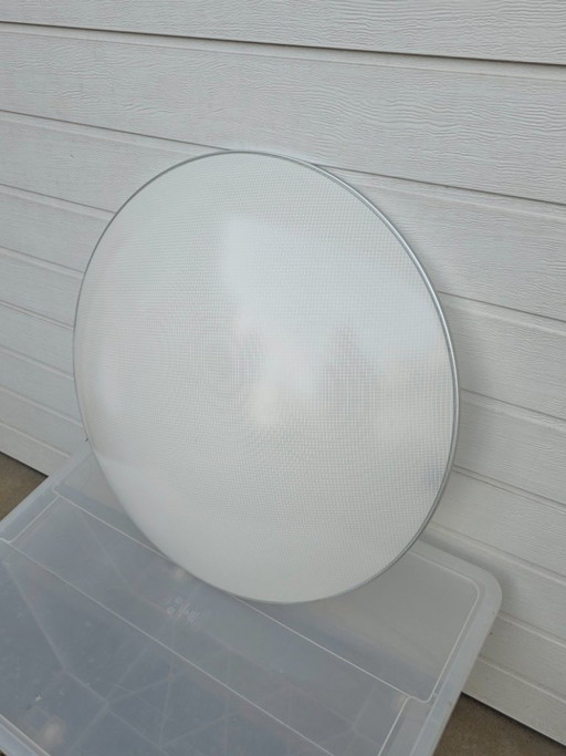 A striking design from 1996 by Luciano Balastrini for Luceplan, a large cutout of a sphere made of polycarbonate featuring a dia