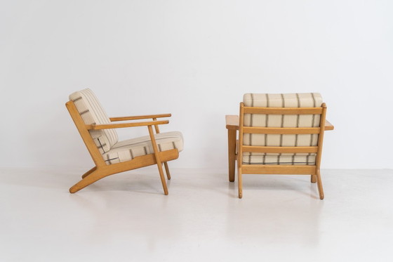 Image 1 of Pair of Early GE-290 lounge chairs in oak by Hans J. Wegner for Getama (Denmark, 1953).