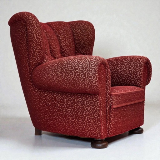 Poltrona relax danese degli anni '60, in lana rossa originale, gambe in legno di quercia.