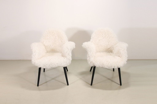 2 Vitra Organic chairs door Charles Eames en Eero Saarinen