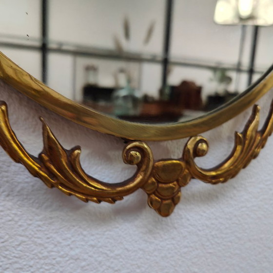 Image 1 of Vintage Goudkleurige Ovale spiegel kuifspiegel schouwspiegel. Koper 