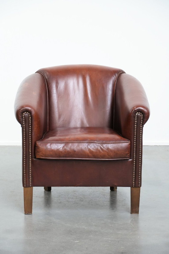 Image 1 of Vintage schapenleren clubfauteuil met siernagels