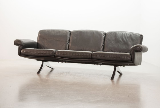 Image 1 of Exquisite Mid-Century Design De Sede Black Leather Strap Stitched Three-Seat Sofa DS31. Switzerland, 1960s.