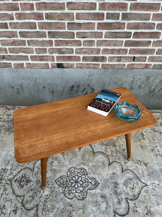 Image 1 of Vintage mid-century Danish coffee table on beautiful tapered legs with brass caps