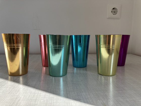 Image 1 of 6 metal retro cups in a tube