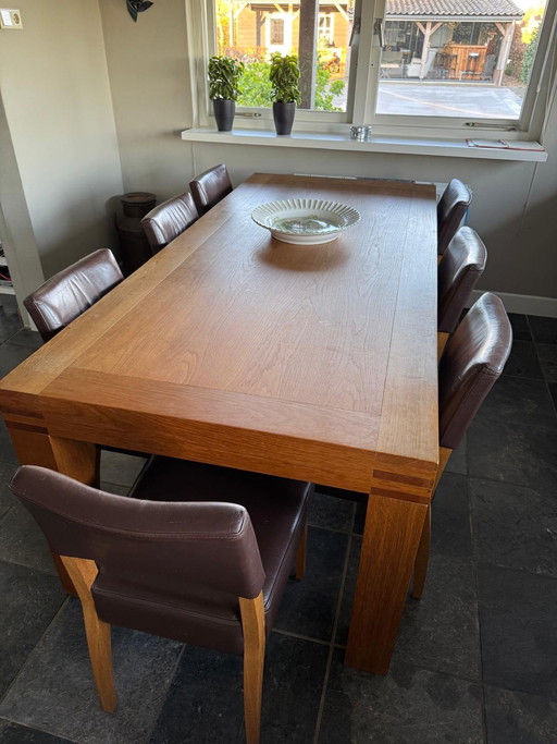 Wooden table with 8 chairs