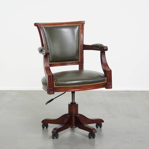 Green cowhide leather and wood office chair with decorative rivets in English style on wheels