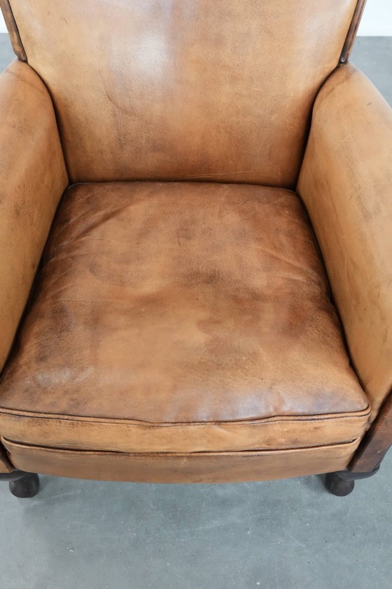 Image 1 of Subtiele vintage schapenleren fauteuil/ armchair met een mooie lichte kleur en sierlijke pootjes