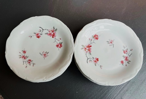 12 white plates with apple blossom motifs, Sologne porcelain