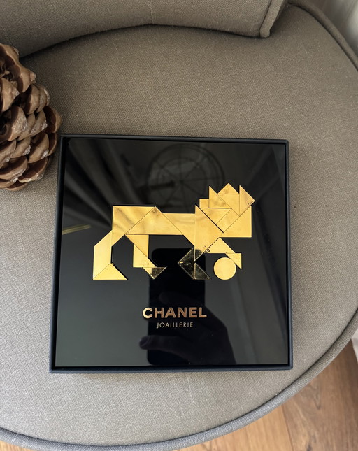Raro león Chanel Tangram