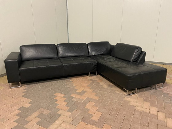 Image 1 of Piet Klerkx zwarte hoekbank van echt leer met comfortabele zitplaatsen en ruime hoek.
