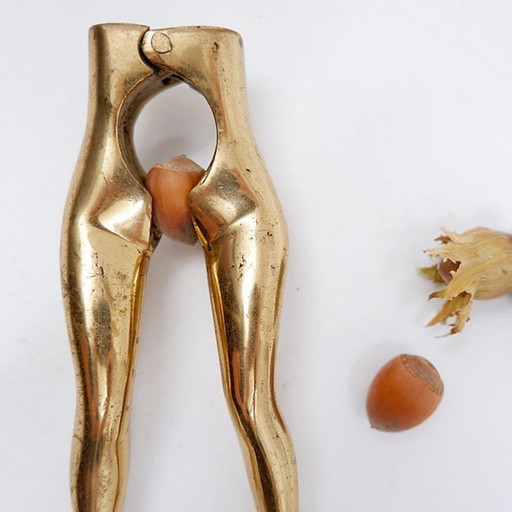 Vintage brass nutcracker in the shape of a woman's legs, 1970s