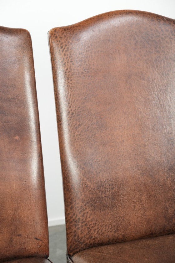 Image 1 of 4 x Vintage eetkamerstoel gemaakt van schapenleer met een hoge rug