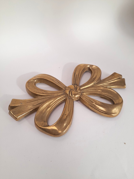 Image 1 of Salvamanteles de latón con doble nudo