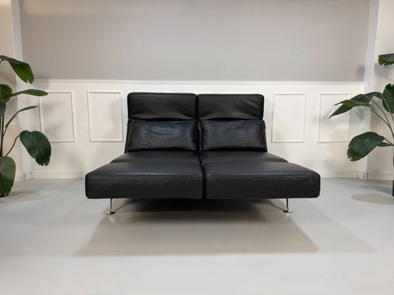 Image 1 of Modèle d'exposition de canapé Brühl Moule en cuir noir avec fonction couchage