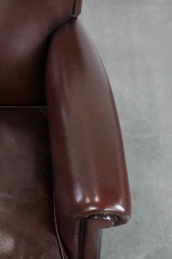 Image 1 of Donkere luxe schapenleren fauteuil/ armchair met een tijdloze uitstraling