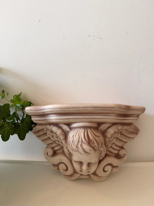 Console murale avec tête d'ange