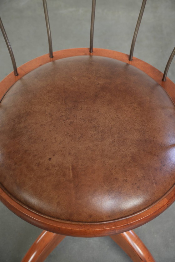 Image 1 of Draaibare Schuitema stoel/ bijzetstoel/ bureaustoel met een cognac kleurige rundleren zitting