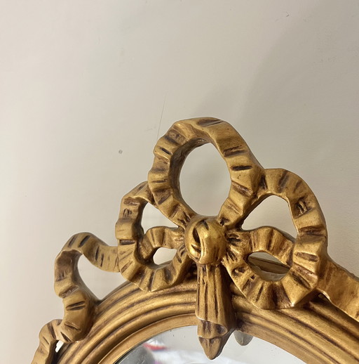 Espejo redondo antiguo con cresta 67x48cm