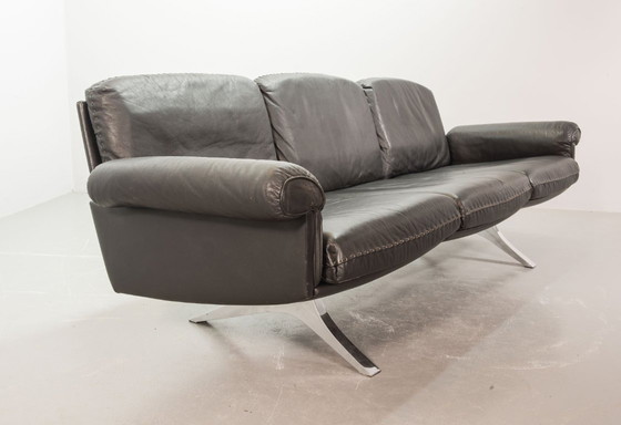 Image 1 of Exquisite Mid-Century Design De Sede Black Leather Strap Stitched Three-Seat Sofa DS31. Switzerland, 1960s.
