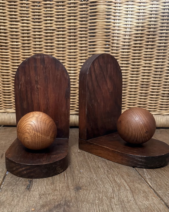 Image 1 of 2x Art Deco bookends. Left the paper in place and don't know if there is anything underneath.