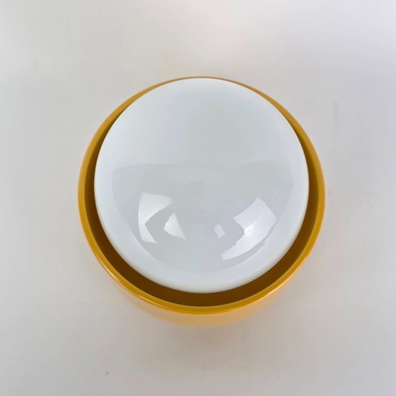 Image 1 of Vintage German ceramic lamp with a glass globe shade. Can be used as a wall lamp, table lamp, or sconce. Yellow. 70s / retro