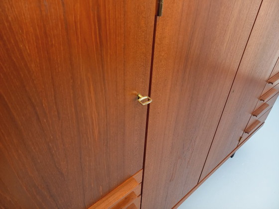Image 1 of Tall, modernist, vintage Scandinavian sideboard in teak and black metal from the 1960s