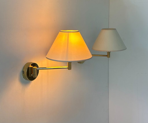 Pair of vintage adjustable wall lights, brass and beige fabric, France, 1970