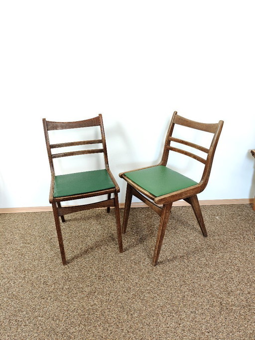 Vintage Paar Esszimmerstühle aus Holz mit grünem Leder / flippige Esszimmerstühle / Mid Century / hergestellt in Jugoslawien