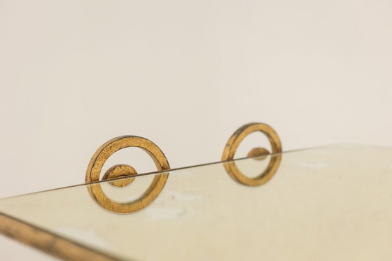 Image 1 of Table basse en fer forgé doré et plateau de verre églomisé. Années 1970