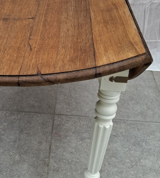 Image 1 of 🪵 Solid oak table with drop leaves — white lacquered legs — vintage chic style