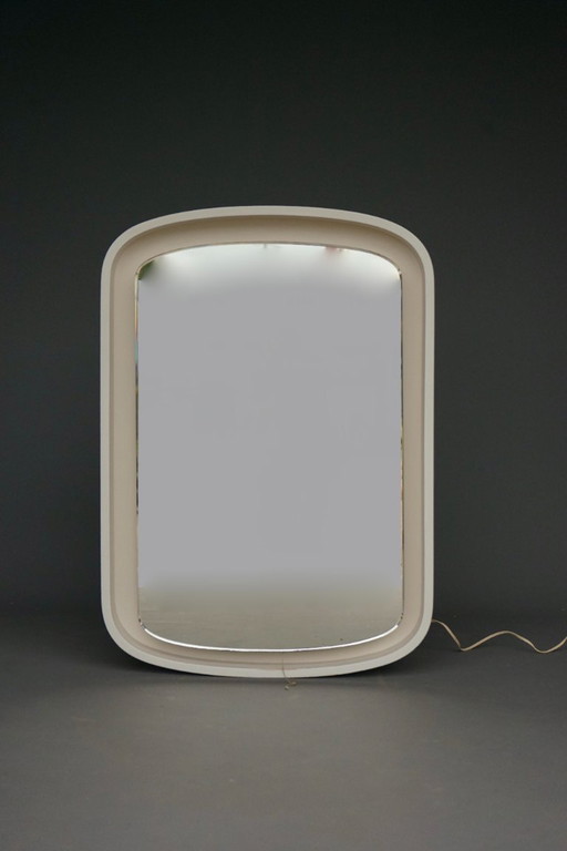 A large 1970s vintage backlit mirror in white plywood frame