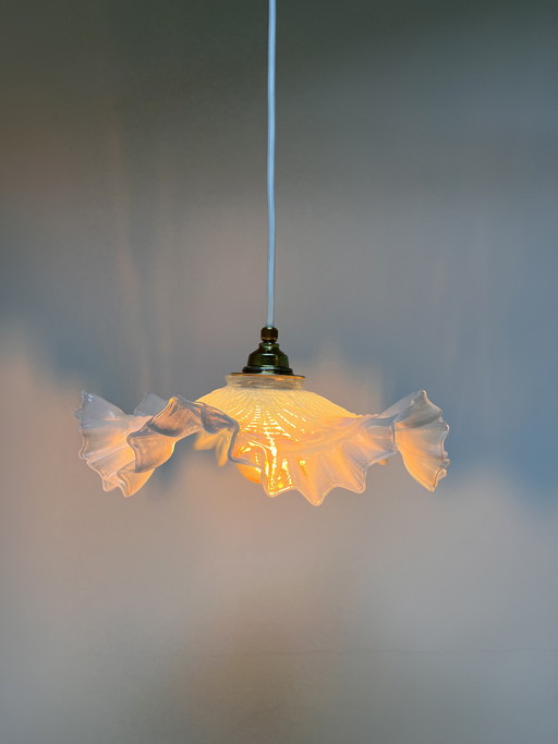 Atmospheric vintage pendant light featuring a distinctive glass shade, likely of French origin