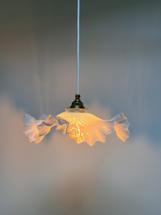 Image 1 of Atmospheric vintage pendant light featuring a distinctive glass shade, likely of French origin
