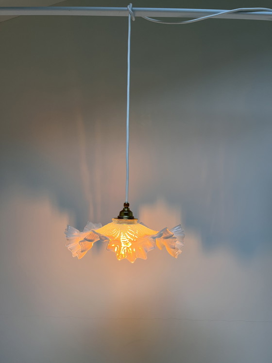 Image 1 of Atmospheric vintage pendant light featuring a distinctive glass shade, likely of French origin