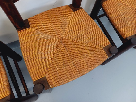 Image 1 of Set van 4 vintage brutalistische stoelen van Georges Robert, gemaakt van hout en stro, uit de jaren 50 en 60.