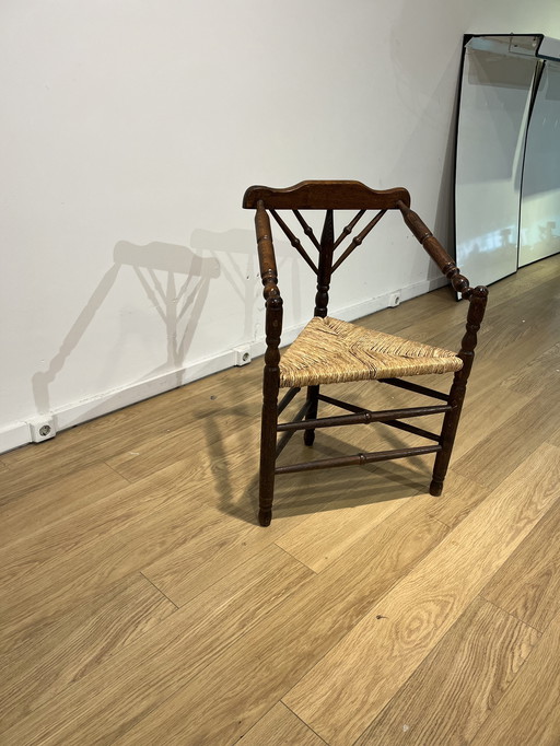 Antique wicker chair three legged