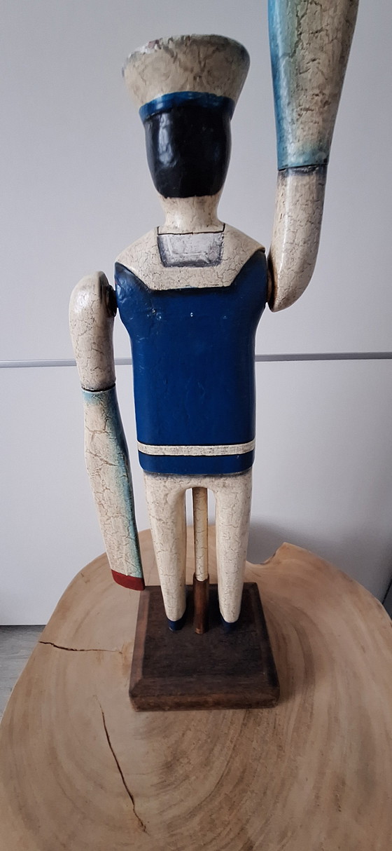 Image 1 of Antieke matroos met roeispanen als armen