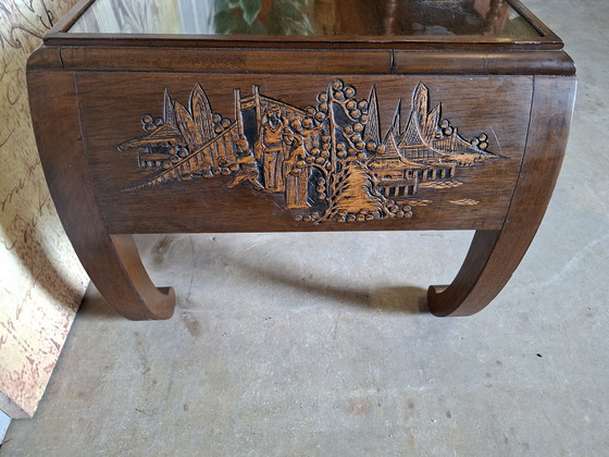 Image 1 of Antique Asian coffee table with beautiful wood carving, dimensions: 100x45cm and 41cm high.