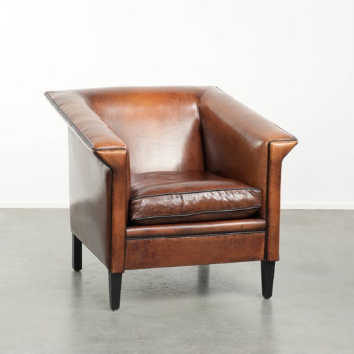 Sheepskin Art Deco design armchair with black piping